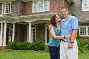 Couple in front of investment property